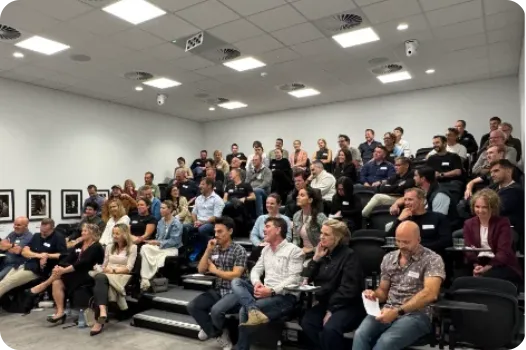 Audience members seated and listening during the panel discussion