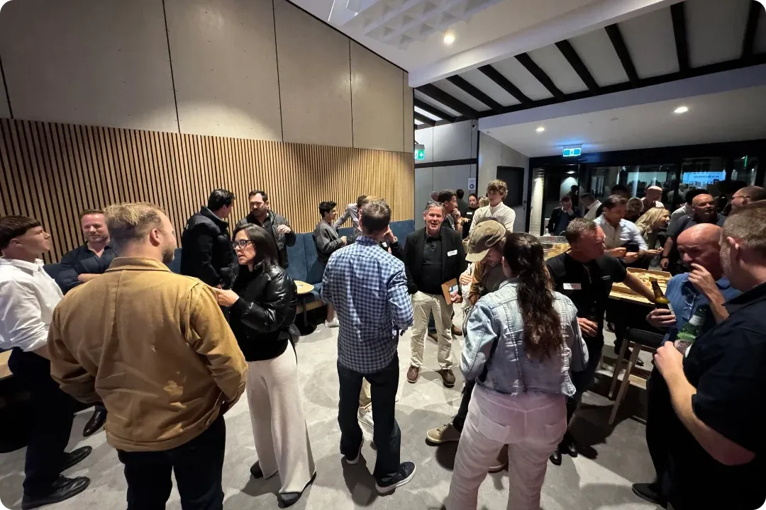 Attendees networking after the panel discussion